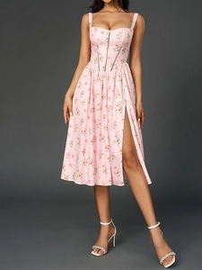 Detail of floral spaghetti strap dress showing corset bodice and high side slit