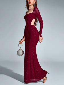 Macro shot of burgundy mesh evening gown featuring sparkling glitter and side cut-out detail