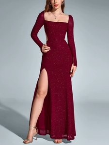 Detail of burgundy sequin dress featuring long sleeves and high slit leg opening
