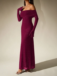 Close-up of sparkly silver sequins on off-shoulder mesh evening gown with flare sleeves