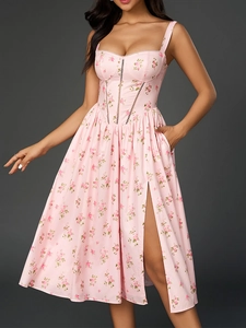 Detail of pink floral dress featuring corset bodice, lace trim and side slit with pocket