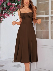 Detail of corset-style brown dress featuring lace-up drawstring neckline and floral print