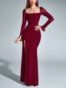 Detailed view of burgundy wine sequin fabric and high slit design on long evening gown
