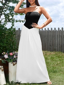 Detail of elegant tube top maxi dress with a black and white color block design