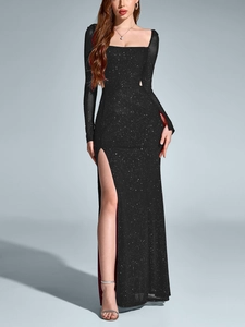 Close-up of sparkling black mesh evening dress with high slit and square neckline