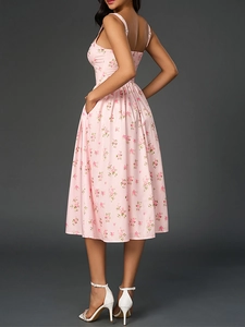 Detail view showing the open back and side pocket of the floral slip maxi dress