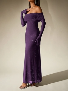 Close-up of purple off-shoulder mesh dress with silver glitter and star-like sequins