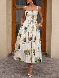 Close-up of floral slip dress featuring side pockets and elegant bustier bodice detail