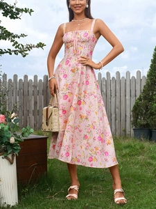 Detail of floral print dress with square neckline, lace-up tie and thin straps