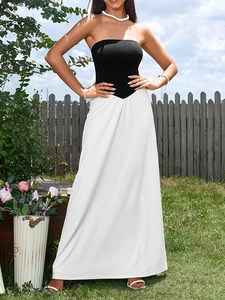 Detail of V-shaped waistline on a black and white strapless maxi bodycon dress
