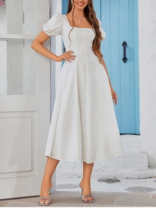 Detailed view of white French vintage puff sleeve dress with a square neckline in the sun