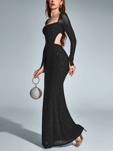 Detail of sequined mesh dress featuring side waist cutout and long sleeves in black