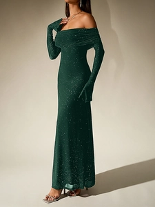 Detail of dark green off-shoulder mesh dress with shimmering sequins and long sleeves