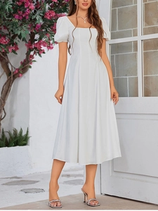 Detail of square neck and puff sleeves on a white elegant A-line midi dress with smocked waist