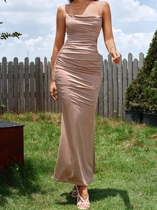 Detailed side view of champagne bodycon dress with elegant ruched texture and slim straps