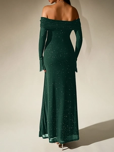 Rear view of dark green off-shoulder evening gown with shimmering mesh and mermaid tail