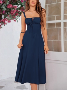 Detailed view of the drawstring pleated bust and spaghetti straps on the navy maxi dress