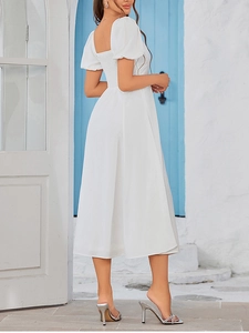 Detail of smocked elastic back and puff sleeves on white A-line midi dress