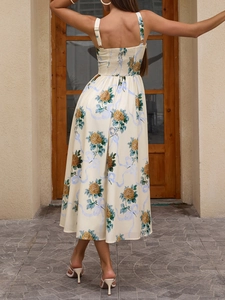 Detail view of the floral slip dress featuring a smocked back and romantic rose pattern
