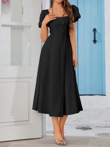 Detail of square neck and puff sleeves on a black A-line midi dress with slim waistline