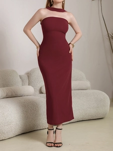 Detail of elegant burgundy tube dress with halter neckline and slim fit maxi silhouette