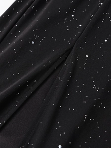 Macro detail of black mesh fabric with sparkling silver glitter for evening gowns