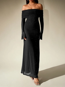 Detail of black off-the-shoulder mesh gown with sparkling silver sequins and long sleeves