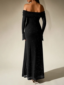 Detail of black off-the-shoulder dress featuring silver glitter mesh and elegant floor-length hem