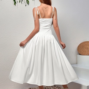Back view of a white lace-up midi dress with smocked bodice and adjustable straps
