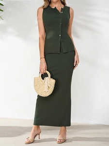 Detail of ribbed knit texture on a dark green sleeveless button-front top and maxi skirt set