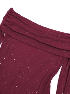 Detail of off-shoulder wine red mesh dress with shimmering silver sequins and pleats