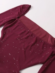 Detail of burgundy mesh dress showing square neckline with silver sequins and ruching