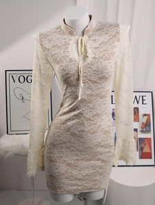 Detail showing the floral lace texture with chest lace-up design and stand collar detail