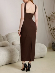 Detail view of a chocolate brown bodycon dress with invisible back zipper and slit