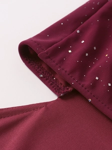 Detailed macro shot of burgundy mesh fabric with sparkling square sequins and neat seams