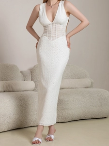 Detailed close-up of white deep V-neck lace dress showing intricate hollow out patterns