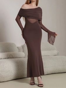 Detail of dark brown bodycon dress with sheer mesh sleeves and ruched neckline