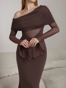 Detail of elegant dark brown dress with mesh panels and ruched fabric texture