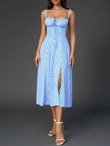 Detail view of blue gingham dress featuring a cinched waist and elegant side split