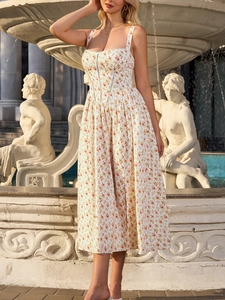 Detail of white floral midi dress with corset-style bodice and elegant lace trimming