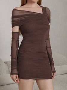Close-up of ruched mesh fabric on a sexy chocolate brown mini dress with sleeves