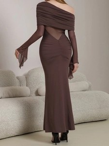 Detail of chocolate brown backless dress with sheer mesh panel and elegant ruching