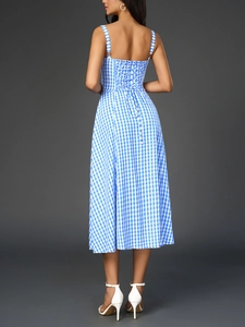 Detail of the blue and white plaid dress featuring a criss-cross lace-up open back design
