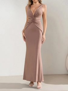 Detail view of the deep V-neckline and gathered pleats on this pink mermaid dress