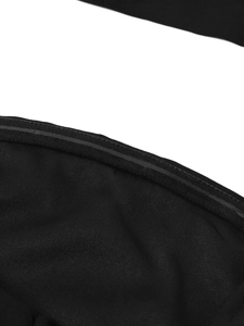Detailed macro view of the non-slip silicone wavy strip inside the black strapless dress