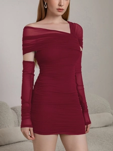 Close-up of ruched mesh detailing on wine red bodycon dress with matching sleeves