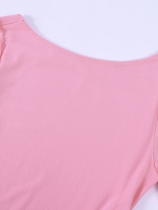 Detailed macro view of pink mesh fabric on a long sleeve backless dress for women