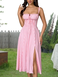 Detail of pink gingham dress featuring front lace-up bust and high slit skirt design