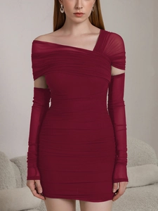 Detailed view of burgundy ruched bodycon dress with sheer mesh sleeves and texture