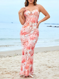 Detail of floral mesh maxi dress with heart-shaped neckline and open back beach style